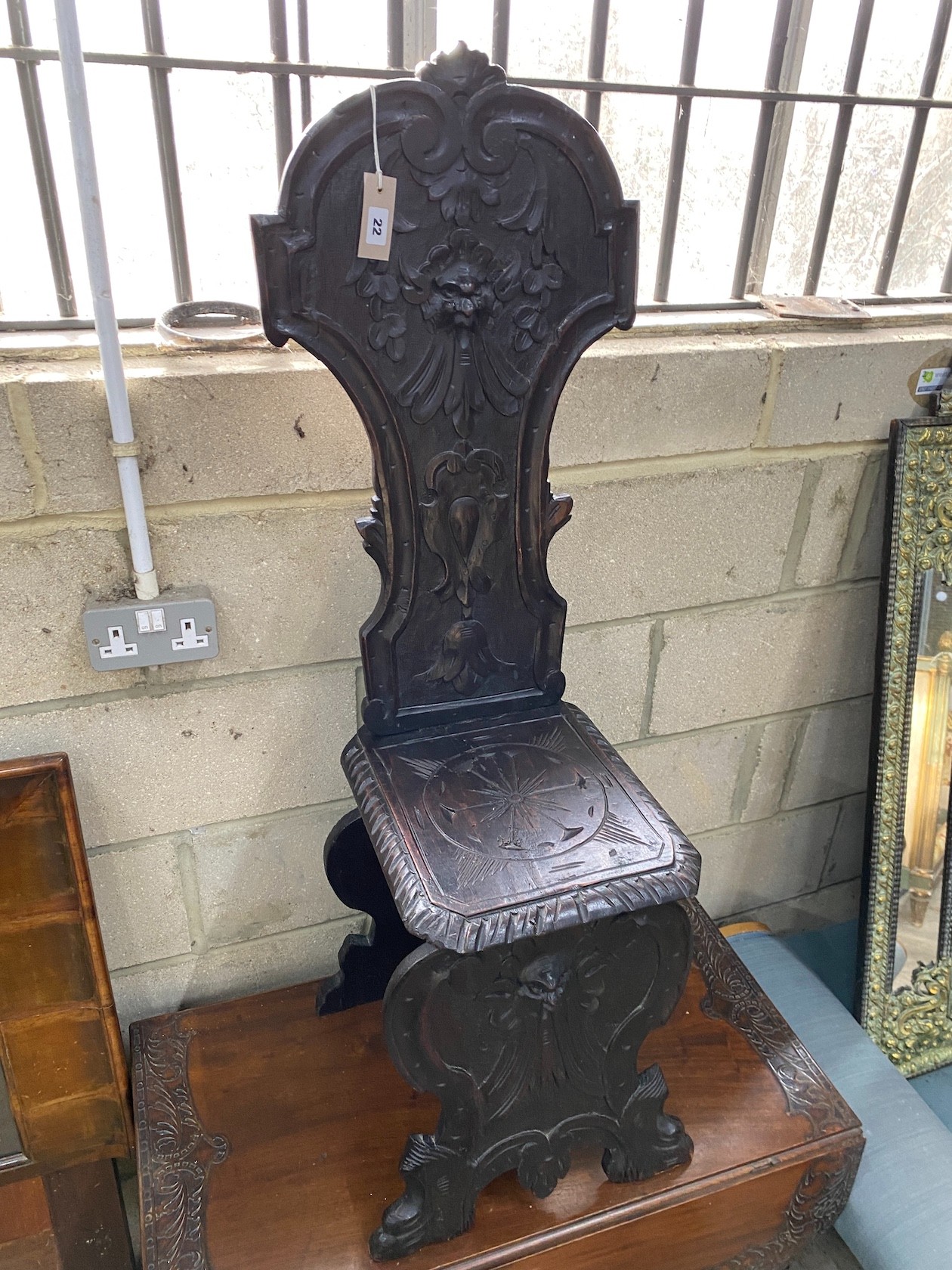 A late Victorian carved fruitwood hall chair, height 118cm